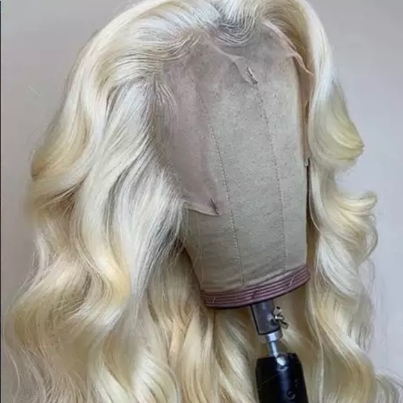 Blonde wig never used. Listed photo of the model too. Shipping can take 2 weeks